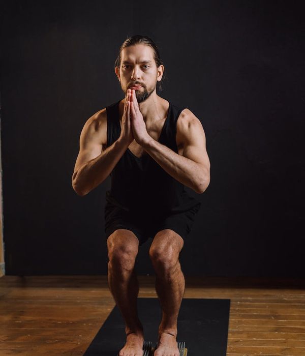 Man in a calm, focused pose, highlighting balance and body control.